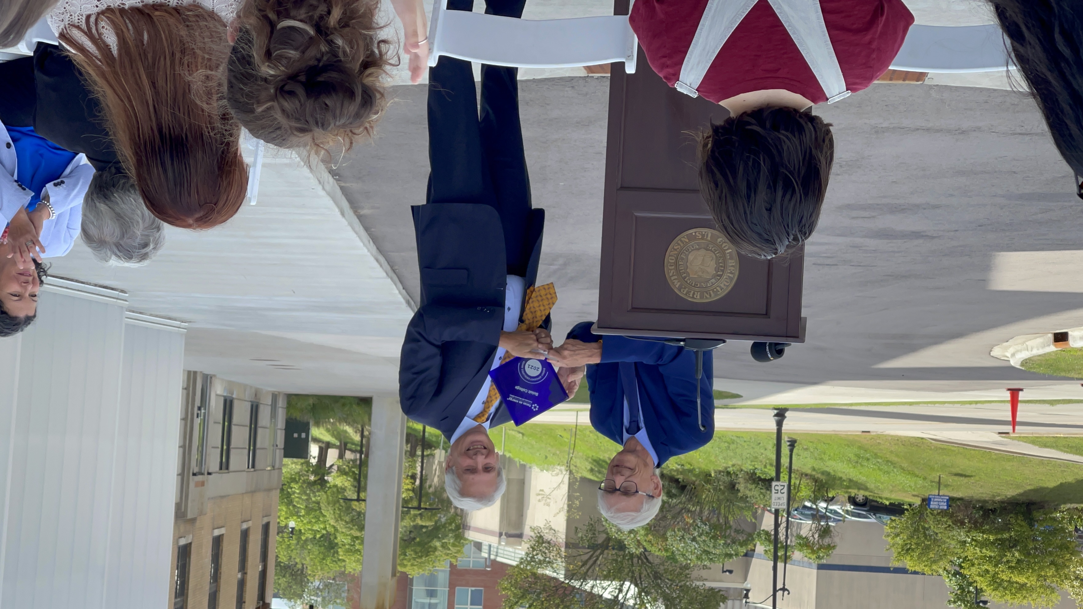 Tony Evers presents award to Beloit College.