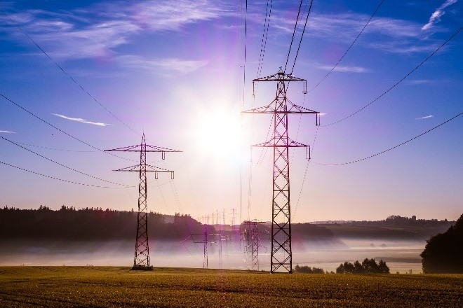 Power lines with sunset in background