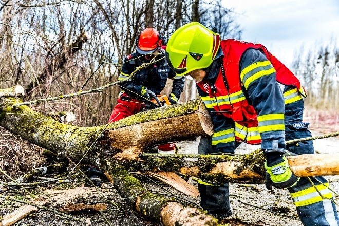 Workers cleaning up storm damage